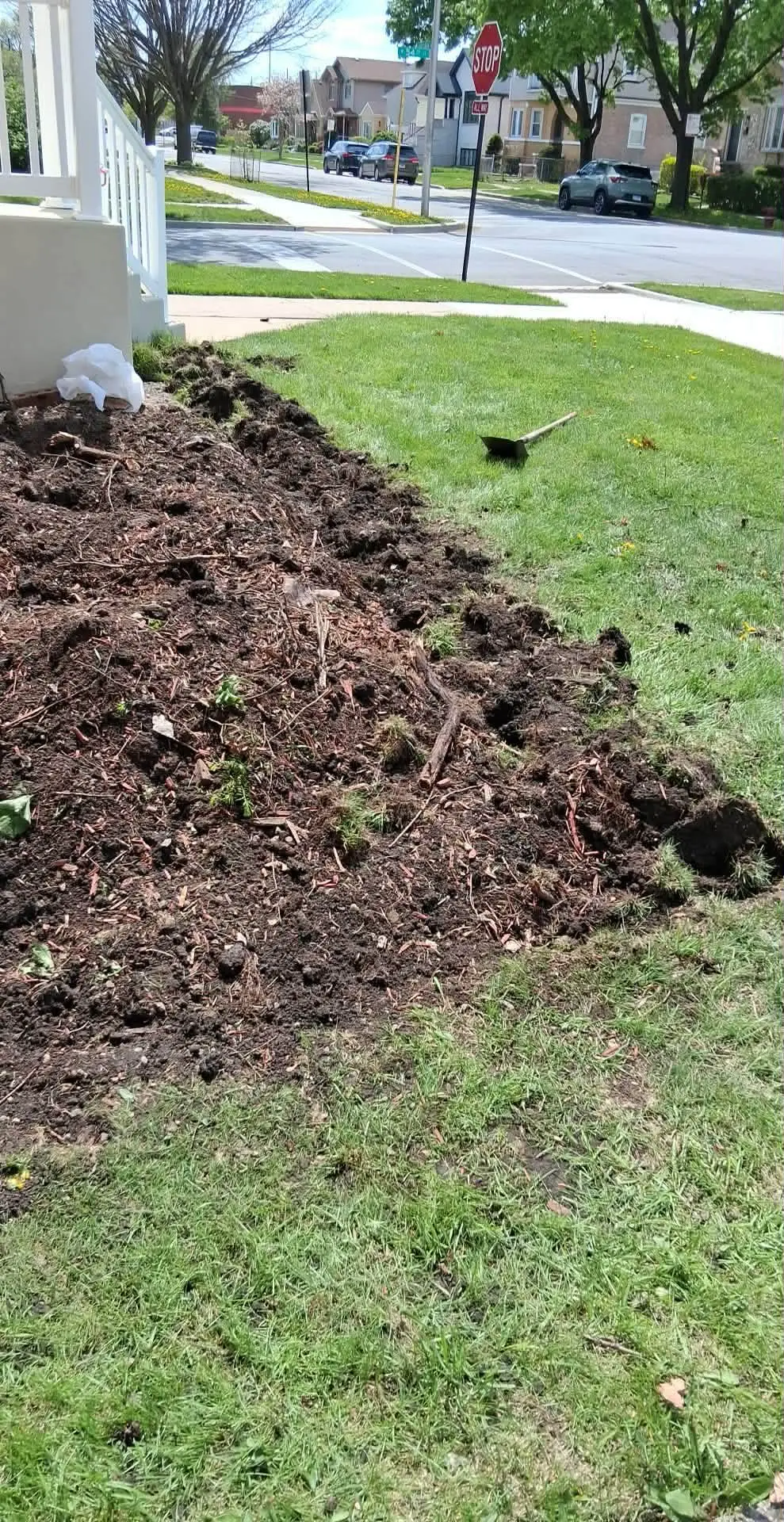 Front yard bed freshly turned and prepped for new plantings
